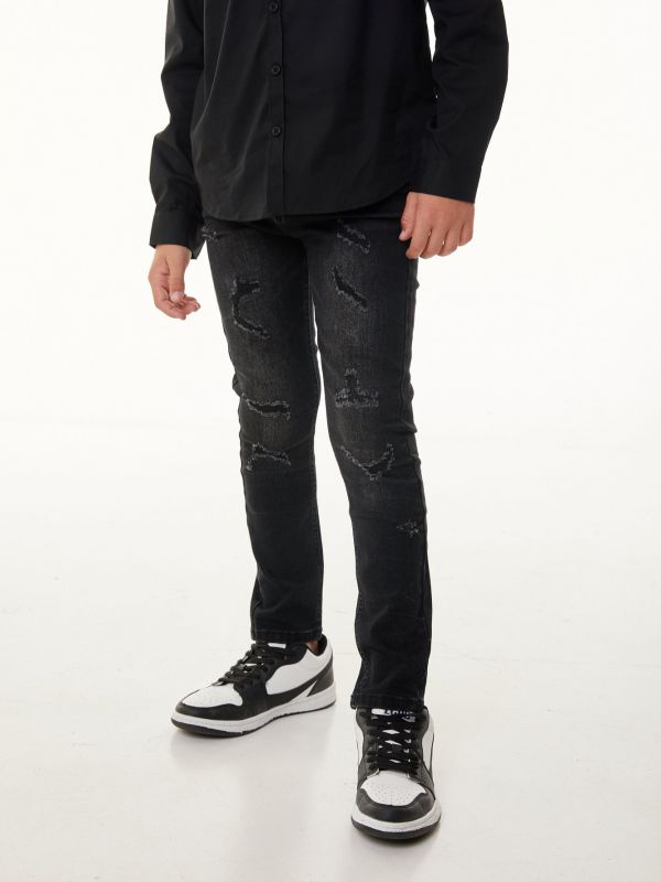 מכנסי ג’ינס בצבע שחור בגזרת סקיני עם קרעים לילדים