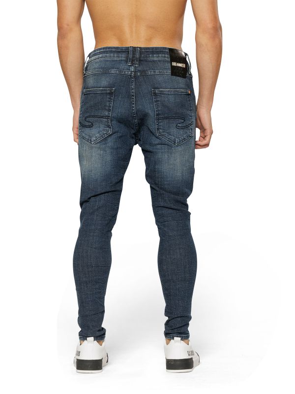 מכנסי ג’ינס COLIN כחול משופשף עם קרעים לגברים