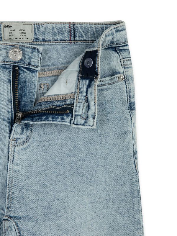 מכנסי ג’ינס OSCAR סקיני עם קרעים לילדים - כחול בהיר